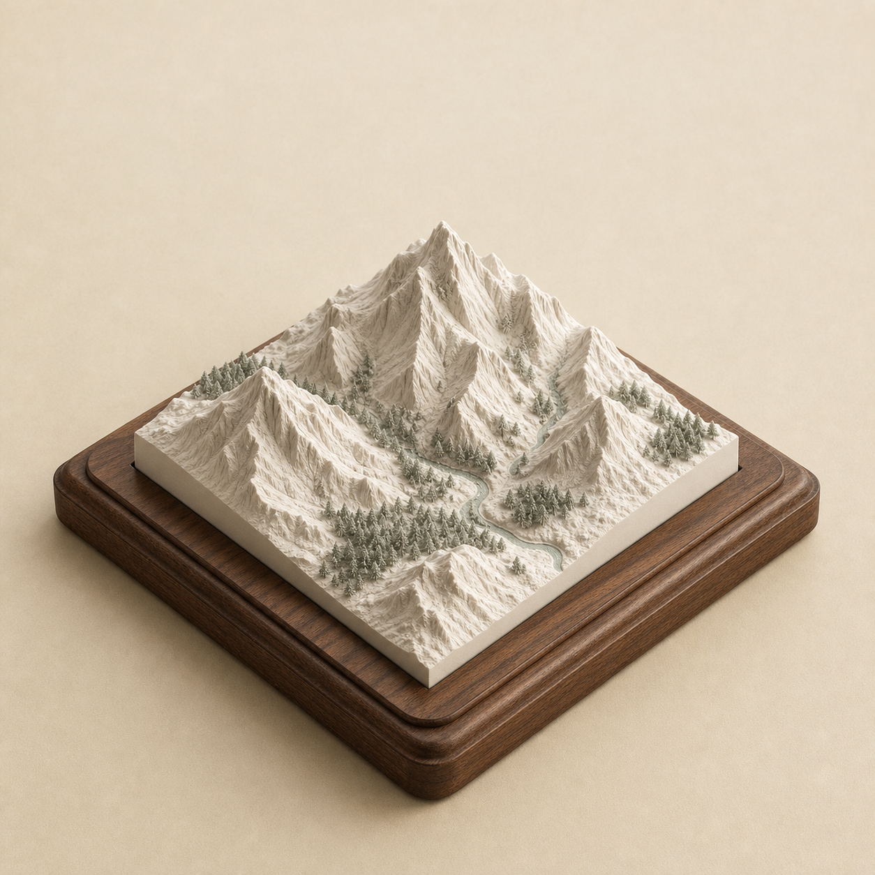 A detailed ivory mountain terrain model presented in a walnut frame